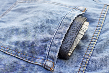 old wallet in back pocket jeans