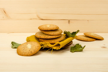 Macaroon homemade, linen napkins on light wooden boards