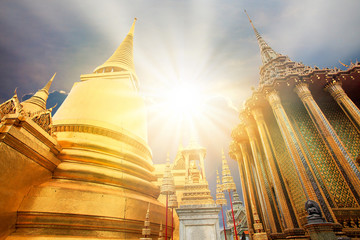 golden buddha pagoda in grand palace and sun light beam bangkok