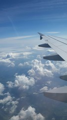 Fototapeta na wymiar Fly by air over white cloud in a blue sky