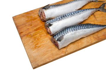 Three mackerel without head on a wooden Board isolated