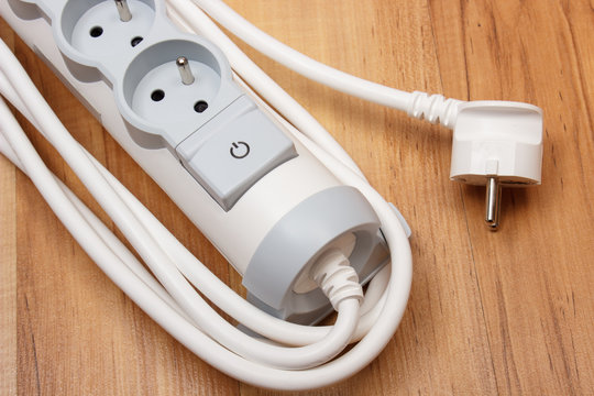 Electrical power strip with switch on-off on wooden floor