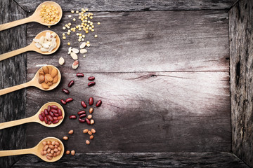 Natural raw nuts food mix on wooden background