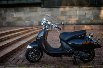 Retro moto scooter on the street.