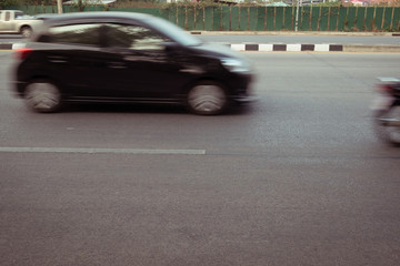 Obraz premium car fast motion blurred driving on road
