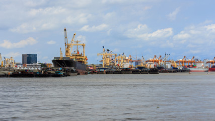 Unloading containers from cargo ships at Bangkok Port