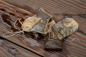 used teabags on a wooden background