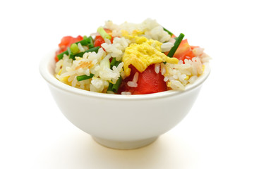 chinese cuisine - homemade fried rice with tomatoes and egg on white with clipping path