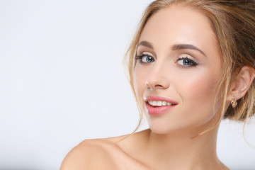 Fototapeta premium Portrait of beautiful woman on white background