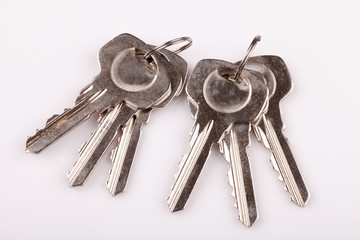 Set of old house keys  on white background