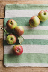 Fresh organic apples, on wooden table
