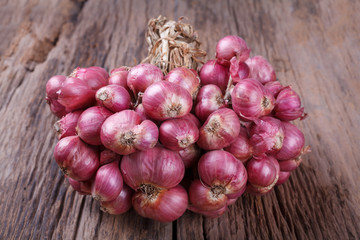 red onions on wood background