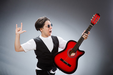 Funny guitar player in musical concept
