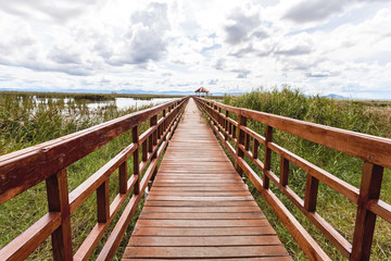 Obraz premium Beautiful of wooden bridge and lake in Sam Roi Yot National Park, Prachuap Khiri Khan, Thailand