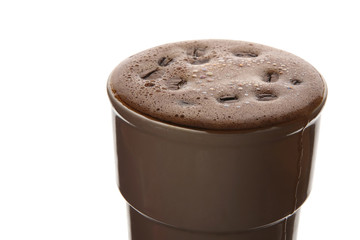 freshly brewed coffee in a Cup on white background closeup