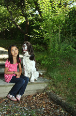 Girl sitting with her dog