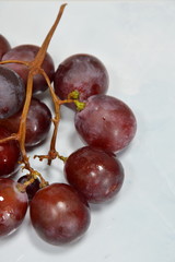 red grape on white tile