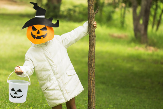 Poor kids play Halloween with the mask handmade (yellow tone)