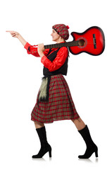 Funny woman in scottish clothing with guitar