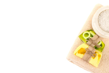 soap and towel near the sea salt isolated on white background