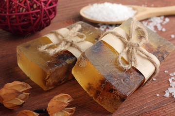 soap with sea salt on wooden background