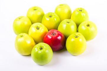 Background of green apples with one red apple. Concept
