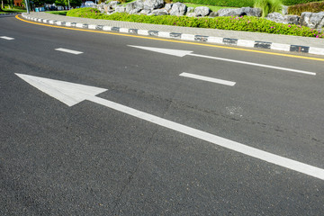 Obraz premium White arrow on Surface traffic