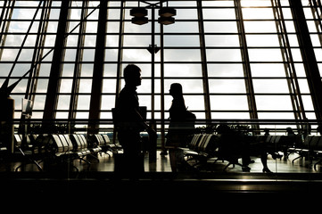 Obraz na płótnie Canvas Airport terminal hall. Walking travelers