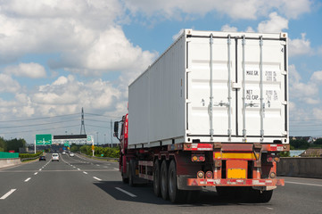 White truck on the asphalt rural road