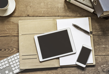 tablet and phone on office folder