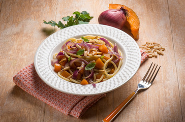 spaghetti with pumpkin onion and parsley