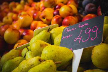 Pears and Peaches at a grocery marketplace stall
