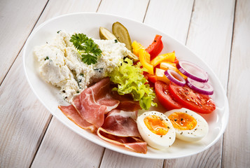 Breakfast - boiled egg, bacon, cottage cheese and vegetables