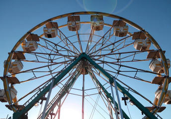 Fototapeta premium aged and worn vintage photo of ferris wheel 