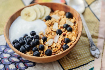 Homemade oatmeal granola with peanuts, blueberry and banana