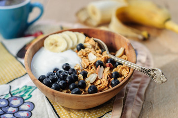 Homemade oatmeal granola with peanuts, blueberry and banana