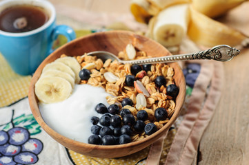 Homemade oatmeal granola with peanuts, blueberry and banana