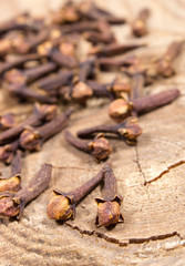 Cloves on a wood board.