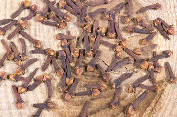 Cloves on a wood board.