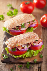 ham sandwich with tomato onion lettuce