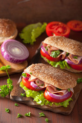 ham sandwich with tomato onion lettuce