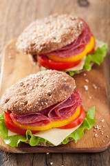 healthy salami sandwich with tomato pepper and lettuce