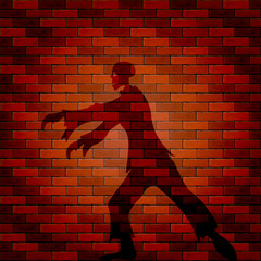 Shadow of zombie on a brick wall
