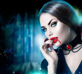 Beautiful halloween vampire woman portrait. Beauty sexy vampire