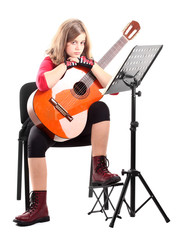Girl with guitar and musical note stand