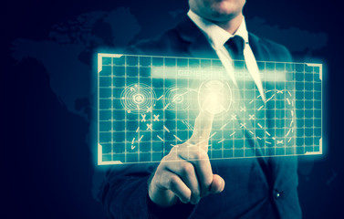 The businessman pressed a button on the high-tech display