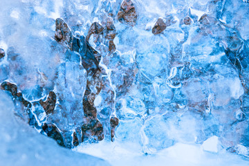 Frozen waterfall in blue ice
