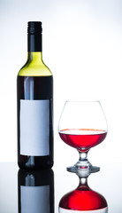 bottle of red wine and wine glass
