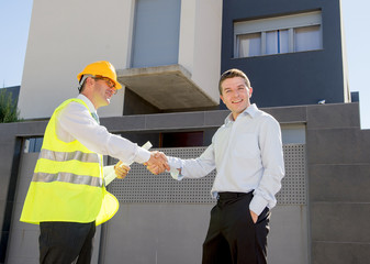 happy customer smiling and constructor foreman worker handshake agreement in real state business