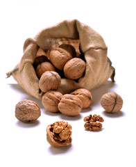 Walnuts and a bag on white